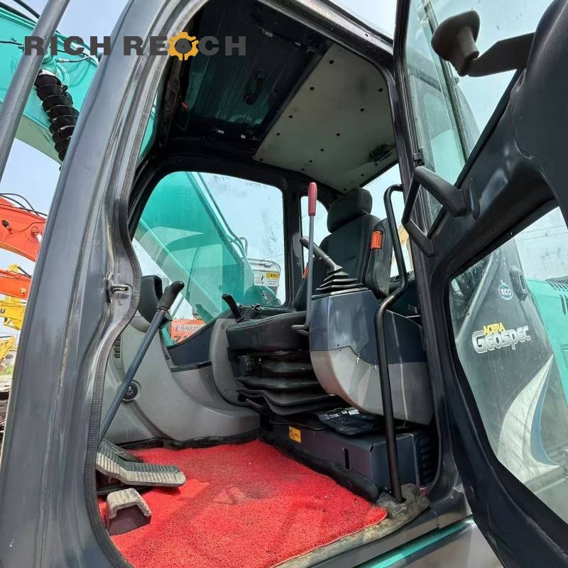 Undercarriage and track system of a 2017 Kobelco SK130 excavator, offered at $20,833